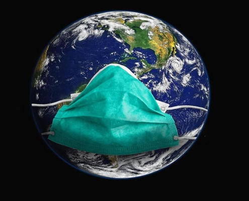 Globe wearing a face mask to represent the COVID-19 pandemic. 